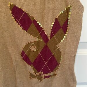 Sleeveless Playboy bunny sweater.